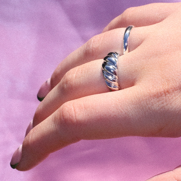 croissant ring, on finger, side view