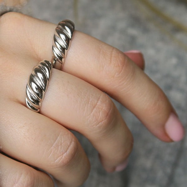 croissant ring, on finger, side view