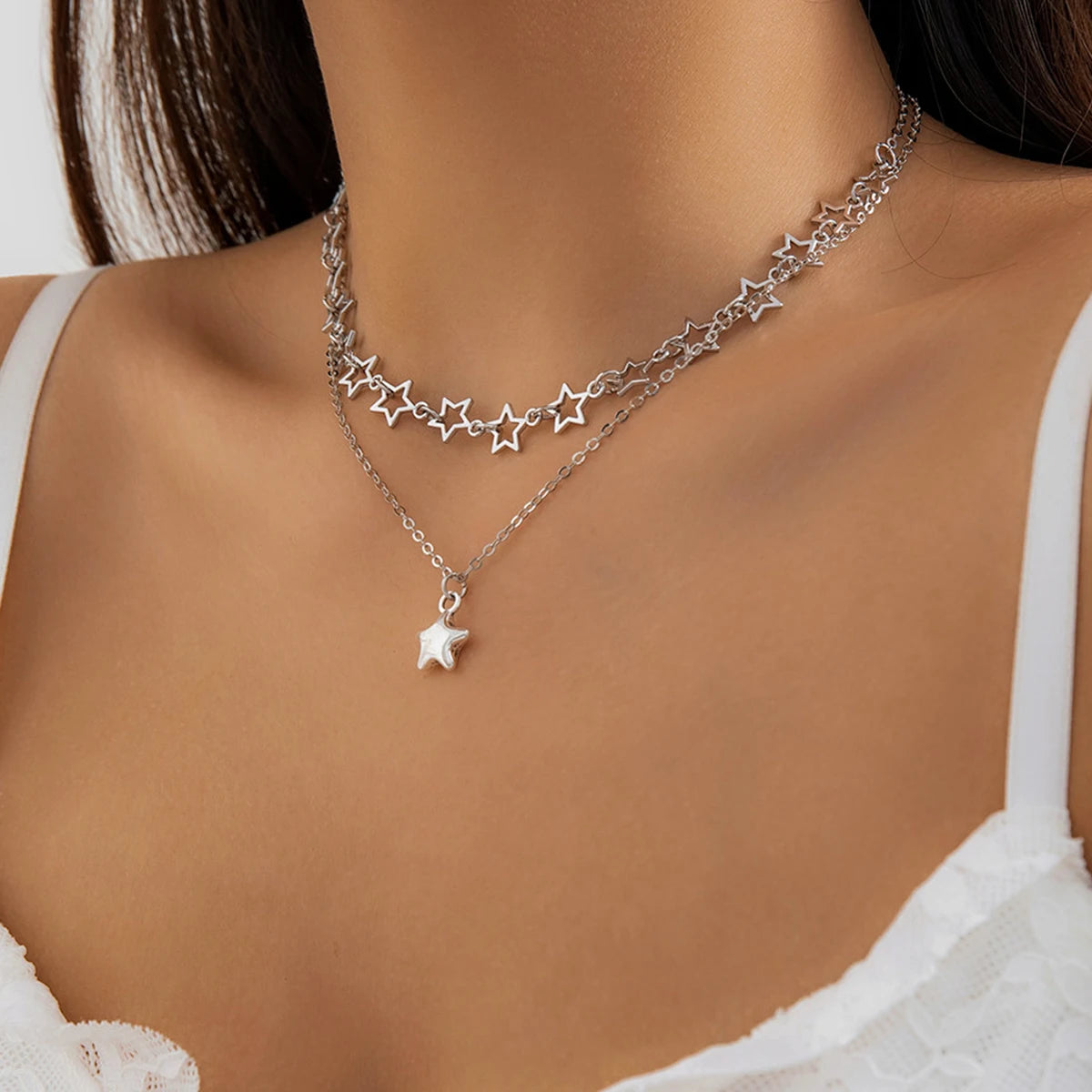 silver starlight necklace, on neck, side view